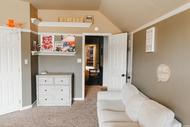 sitting room featuring carpet, lofted ceiling, and baseboards