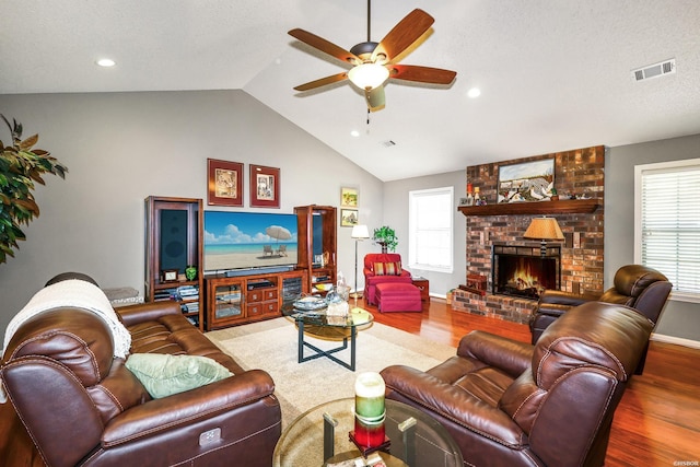 113 Deerview Cir, Hot Springs, AR 71913 - living area with wood finished floors, ceiling fan, lofted ceiling, a fireplace, and plenty of natural light
