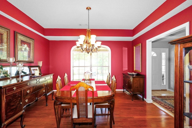 113 Deerview Cir, Hot Springs, AR 71913 - dining area featuring a chandelier, dark wood finished floors, and baseboards