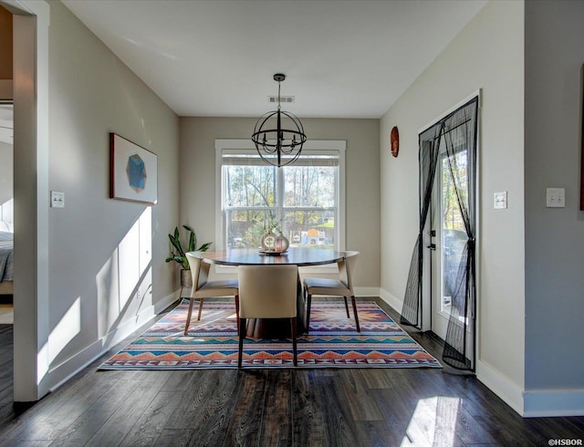 126 Luek Ln, Hot Springs, AR 71913 - dining space featuring a notable chandelier, dark wood-style flooring, visible vents, and baseboards