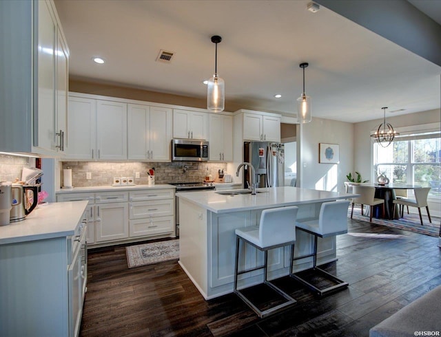 126 Luek Ln, Hot Springs, AR 71913 - kitchen with light countertops, appliances with stainless steel finishes, a kitchen island with sink, white cabinets, and a sink