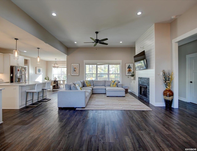 126 Luek Ln, Hot Springs, AR 71913 - living room featuring a large fireplace, dark wood-style flooring, baseboards, and recessed lighting