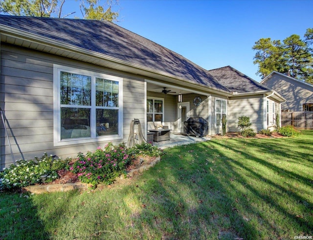 126 Luek Ln, Hot Springs, AR 71913 - rear view of property featuring ceiling fan, roof with shingles, a lawn, and a patio