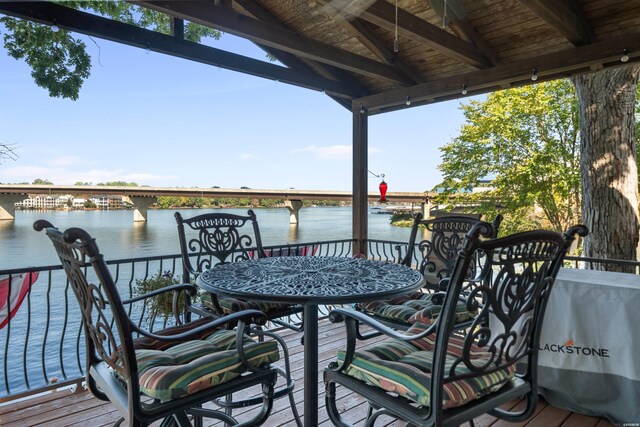 wooden deck with a water view