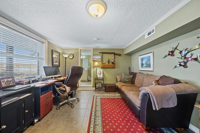 office with visible vents, ornamental molding, a textured ceiling, and light tile patterned flooring