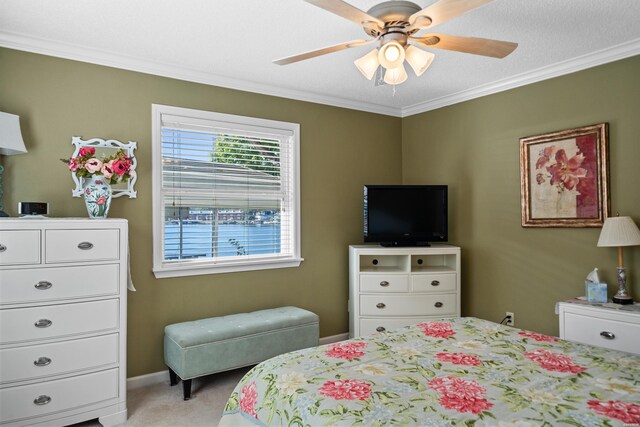 bedroom with ceiling fan, ornamental molding, baseboards, and light colored carpet