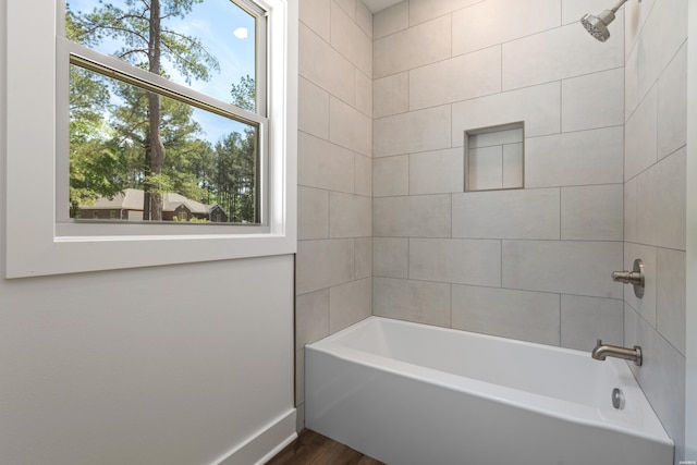 full bath featuring tub / shower combination and wood finished floors