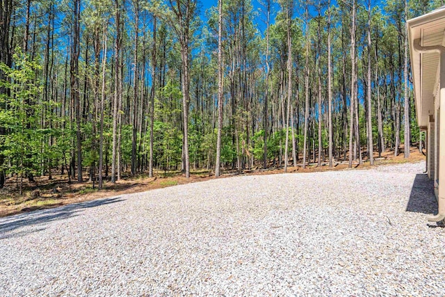 exterior space featuring a forest view