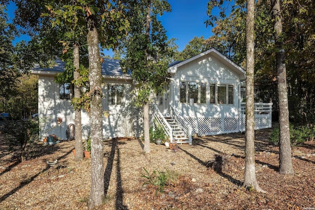 view of front of property featuring a sunroom