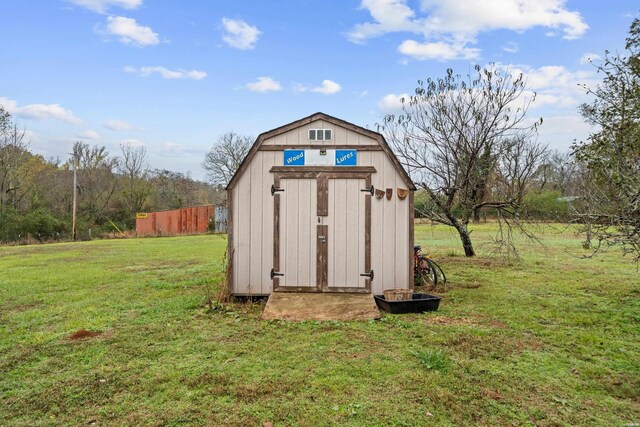 view of shed featuring fence