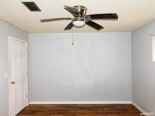 unfurnished room featuring baseboards, ceiling fan, visible vents, and wood finished floors