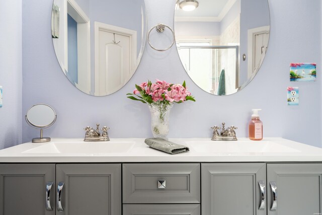 bathroom with a sink and double vanity