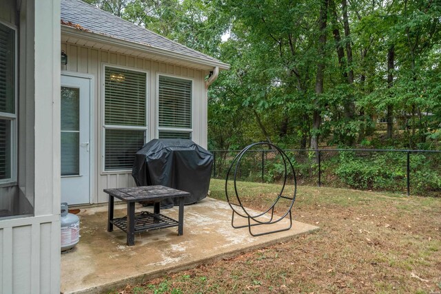 view of yard with fence and a patio