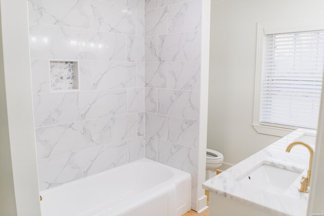 full bathroom featuring toilet,  shower combination, and vanity