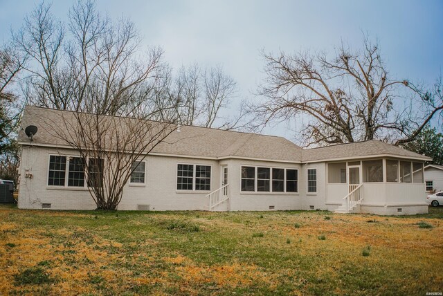 back of house with entry steps, crawl space, and a sunroom