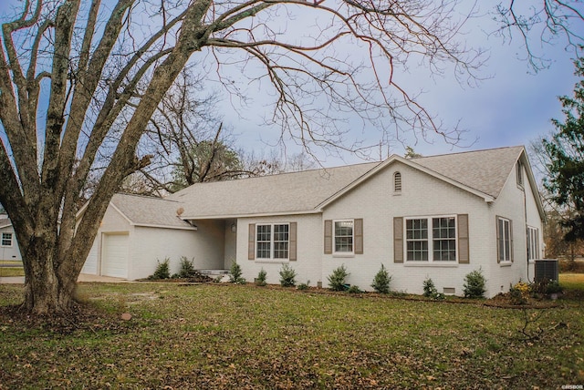 single story home featuring central AC unit, an attached garage, brick siding, crawl space, and a front lawn