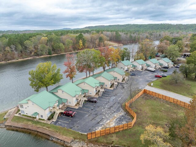 bird's eye view featuring a water view and a wooded view