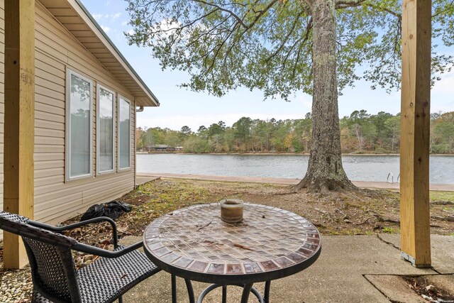 view of patio with a water view