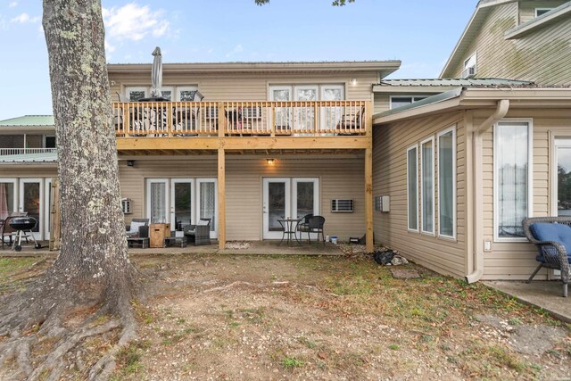 back of property with a patio and french doors