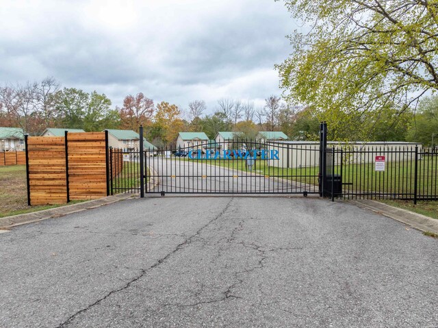 view of gate with fence