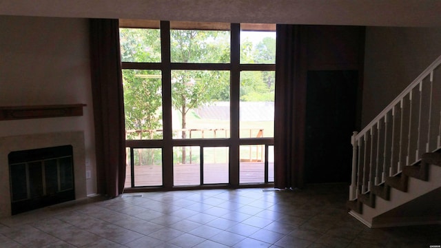 120 Cash St Unit C8, Hot Springs, AR 71913 - interior space with stairway, tile patterned flooring, and a glass covered fireplace