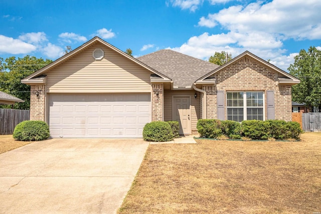 ranch-style house featuring brick siding, fence, and an attached garage