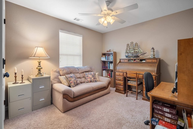 office area featuring light carpet, ceiling fan, and visible vents