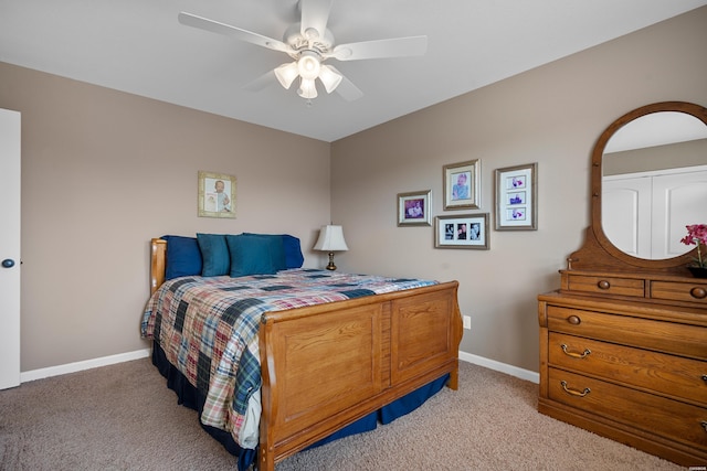 bedroom featuring light carpet, ceiling fan, and baseboards