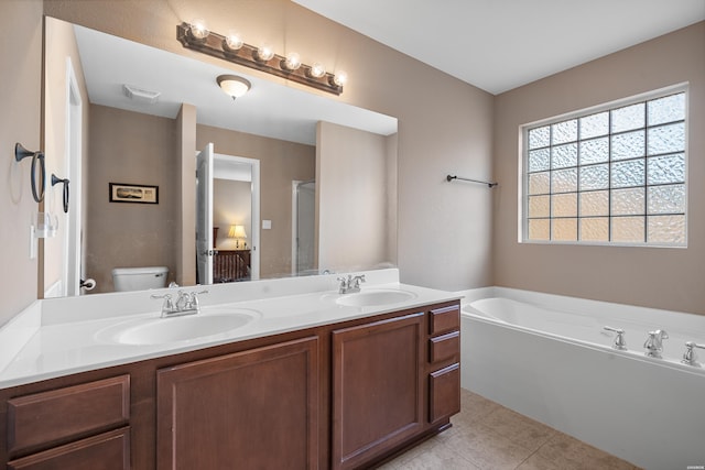 full bathroom featuring double vanity, a sink, a bath, and tile patterned floors