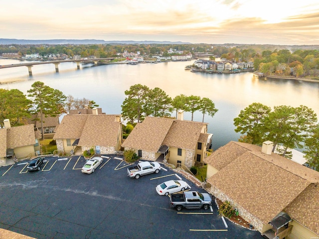 aerial view at dusk with a water view