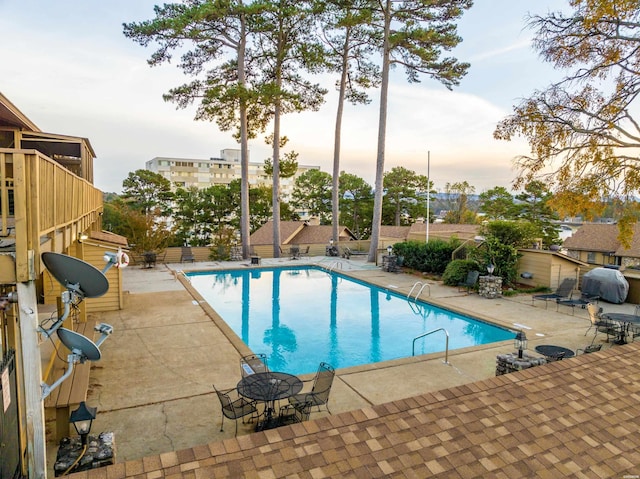 pool with a patio