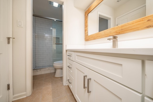 bathroom with toilet, a stall shower, visible vents, and tile patterned floors