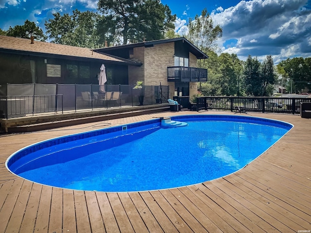 view of pool featuring a fenced in pool and a wooden deck