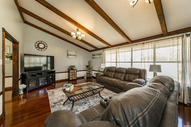 living room with vaulted ceiling with beams, a textured ceiling, wood finished floors, and an inviting chandelier