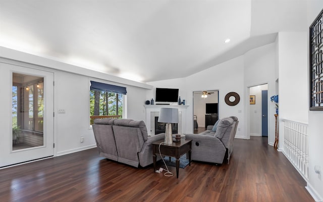 129 Mesero Way, Hot Springs Village, AR 71909 - living area featuring dark wood-style flooring, a tiled fireplace, a ceiling fan, vaulted ceiling, and baseboards