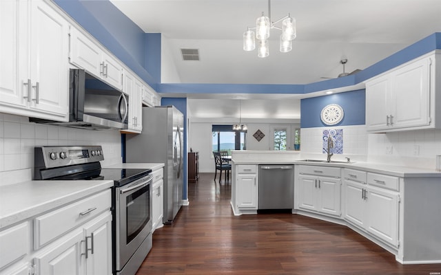 129 Mesero Way, Hot Springs Village, AR 71909 - kitchen with stainless steel appliances, a peninsula, light countertops, and white cabinets