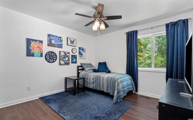 129 Mesero Way, Hot Springs Village, AR 71909 - bedroom with dark wood-style floors, baseboards, and a ceiling fan