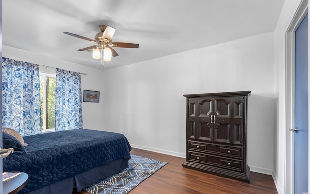 129 Mesero Way, Hot Springs Village, AR 71909 - bedroom featuring dark wood-style floors, ceiling fan, and baseboards