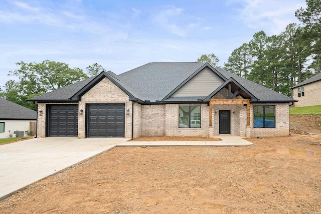 135 Ridgeway Pl, Hot Springs, AR 71901 - view of front of home with brick siding, driveway, an attached garage, and a shingled roof