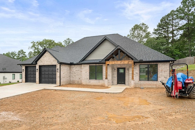 135 Ridgeway Pl, Hot Springs, AR 71901 - view of front facade featuring brick siding, a garage, concrete driveway, and a shingled roof