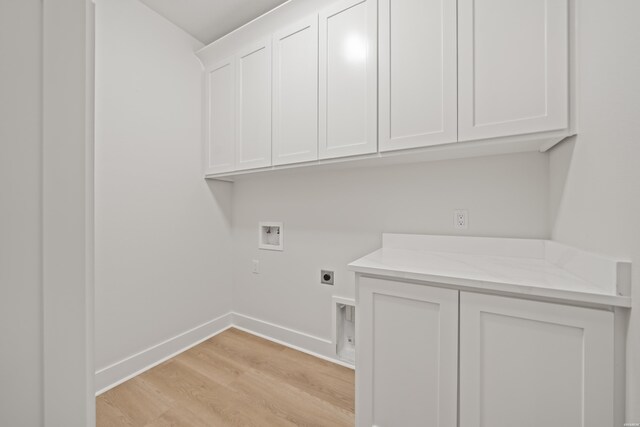 135 Ridgeway Pl, Hot Springs, AR 71901 - washroom with electric dryer hookup, hookup for a washing machine, light wood-style flooring, cabinet space, and baseboards