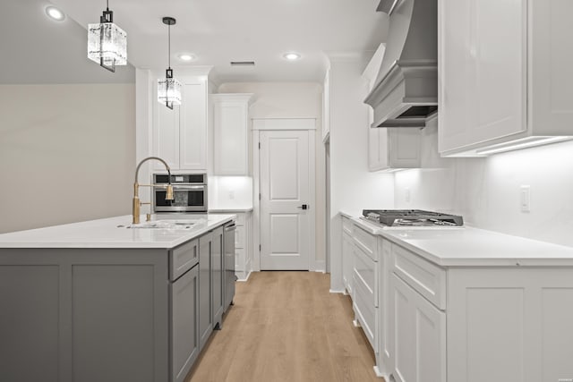 135 Ridgeway Pl, Hot Springs, AR 71901 - kitchen featuring custom exhaust hood, gray cabinets, a sink, appliances with stainless steel finishes, and light wood-style floors