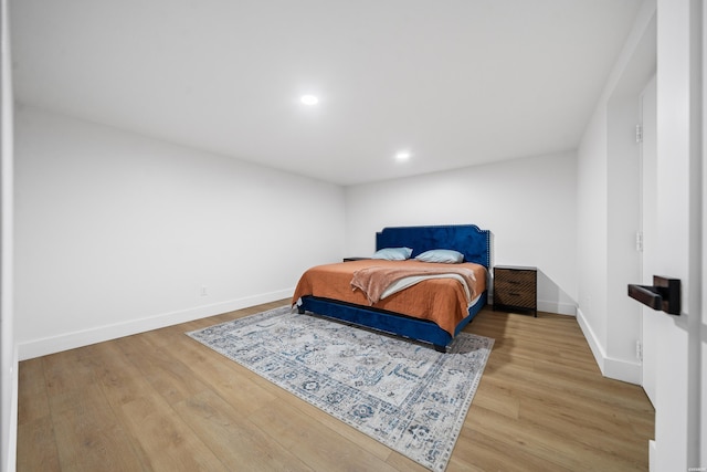 bedroom featuring recessed lighting, wood finished floors, and baseboards