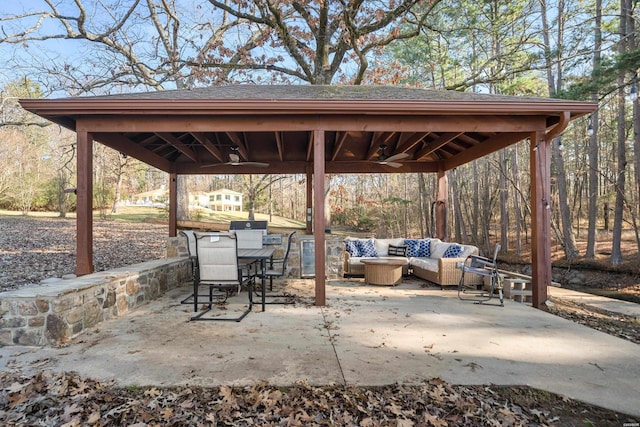 view of patio / terrace with a ceiling fan, a gazebo, and an outdoor hangout area