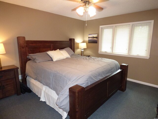 bedroom with a ceiling fan, carpet, and baseboards