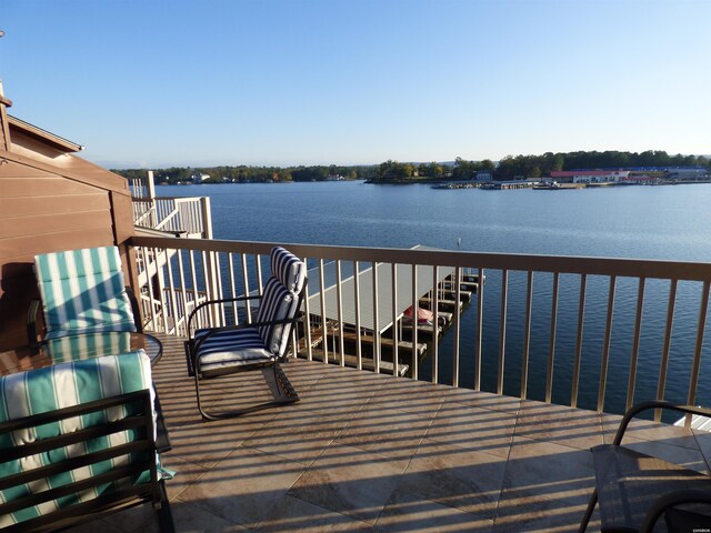 wooden terrace with a water view