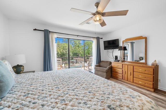 bedroom featuring a ceiling fan, light wood-style flooring, and access to exterior