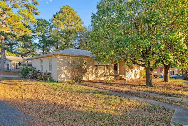 view of front of house with brick siding