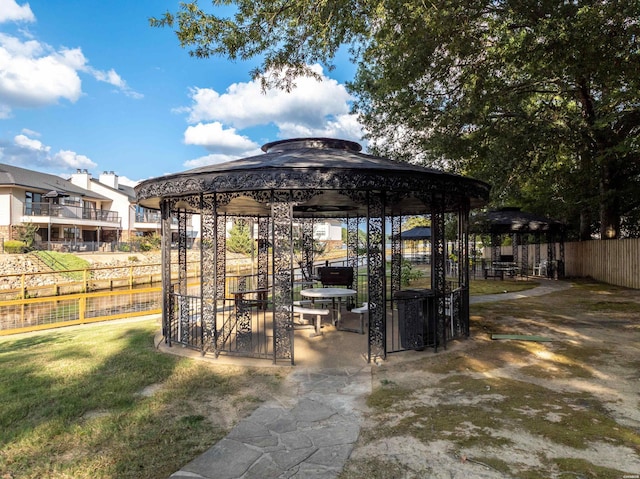 view of patio with fence and a gazebo