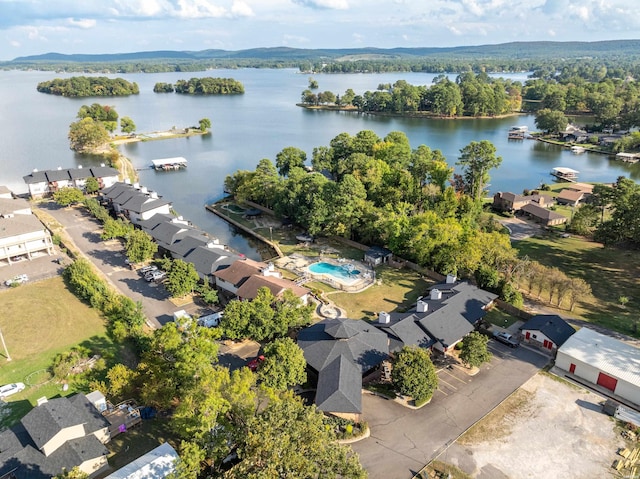 drone / aerial view with a water view and a residential view